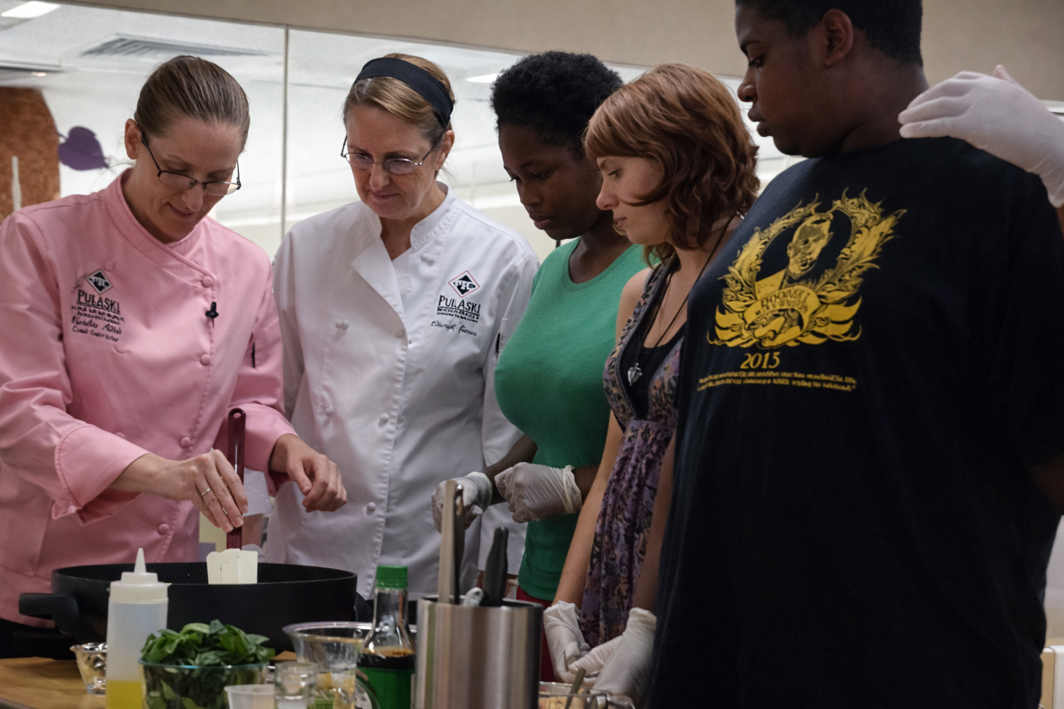 Interactive cooking demo with teens.