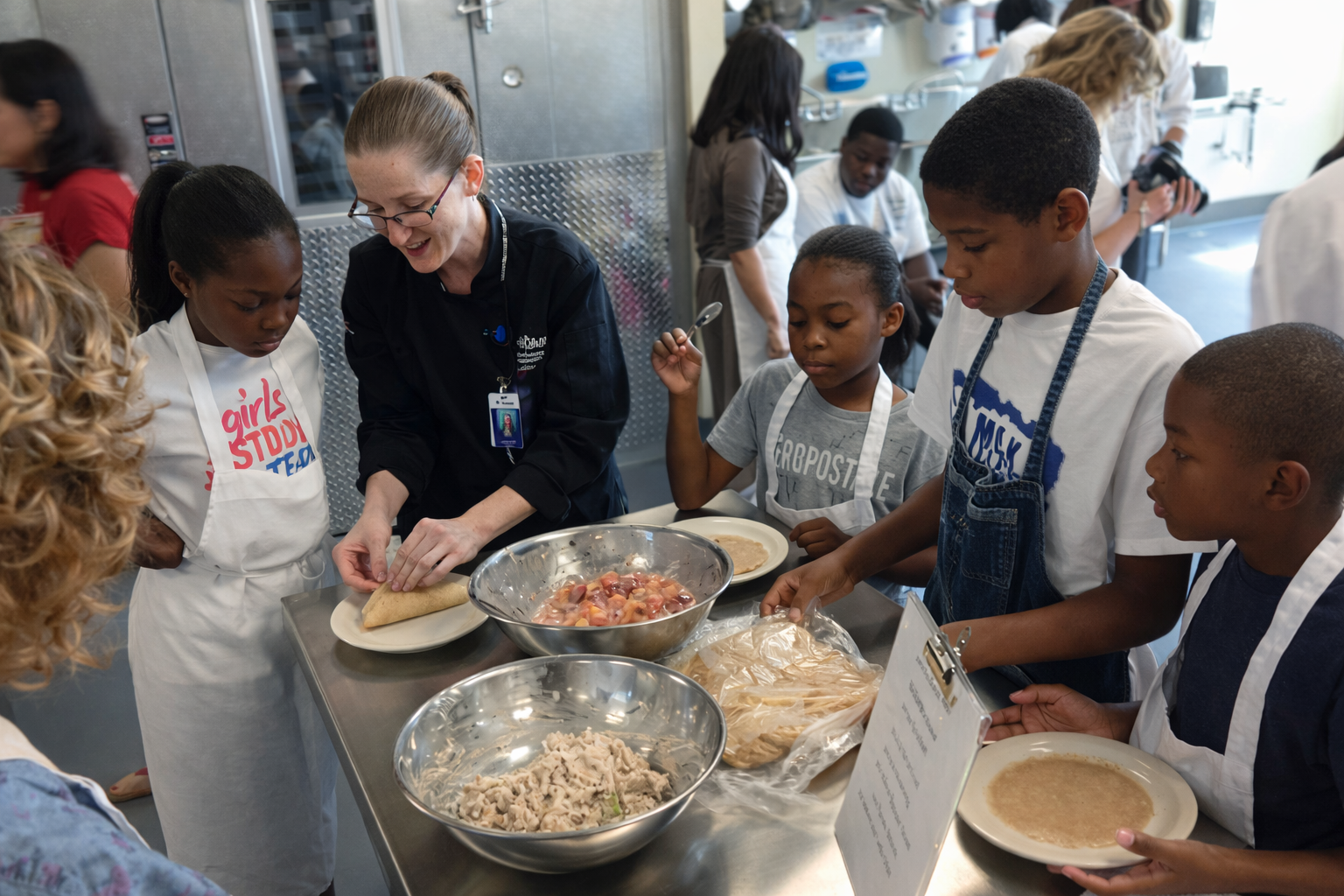 Rolling crepes during a cooking lesson.