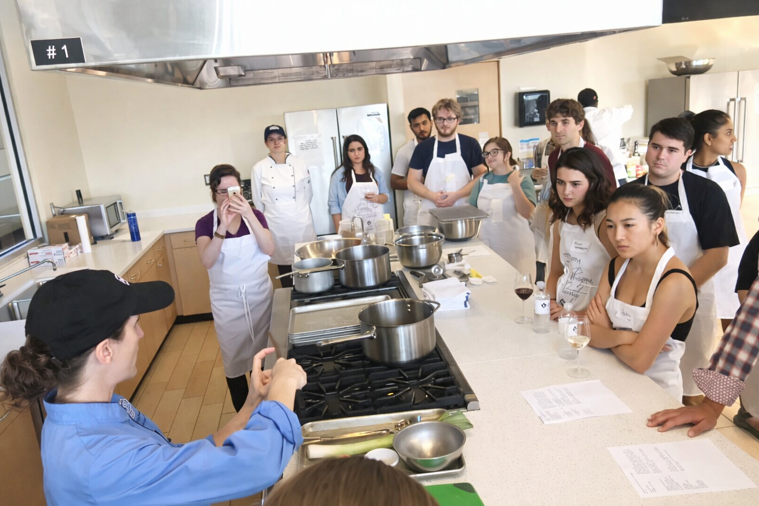 Cooking demonstration with a group in a teaching kitchen.